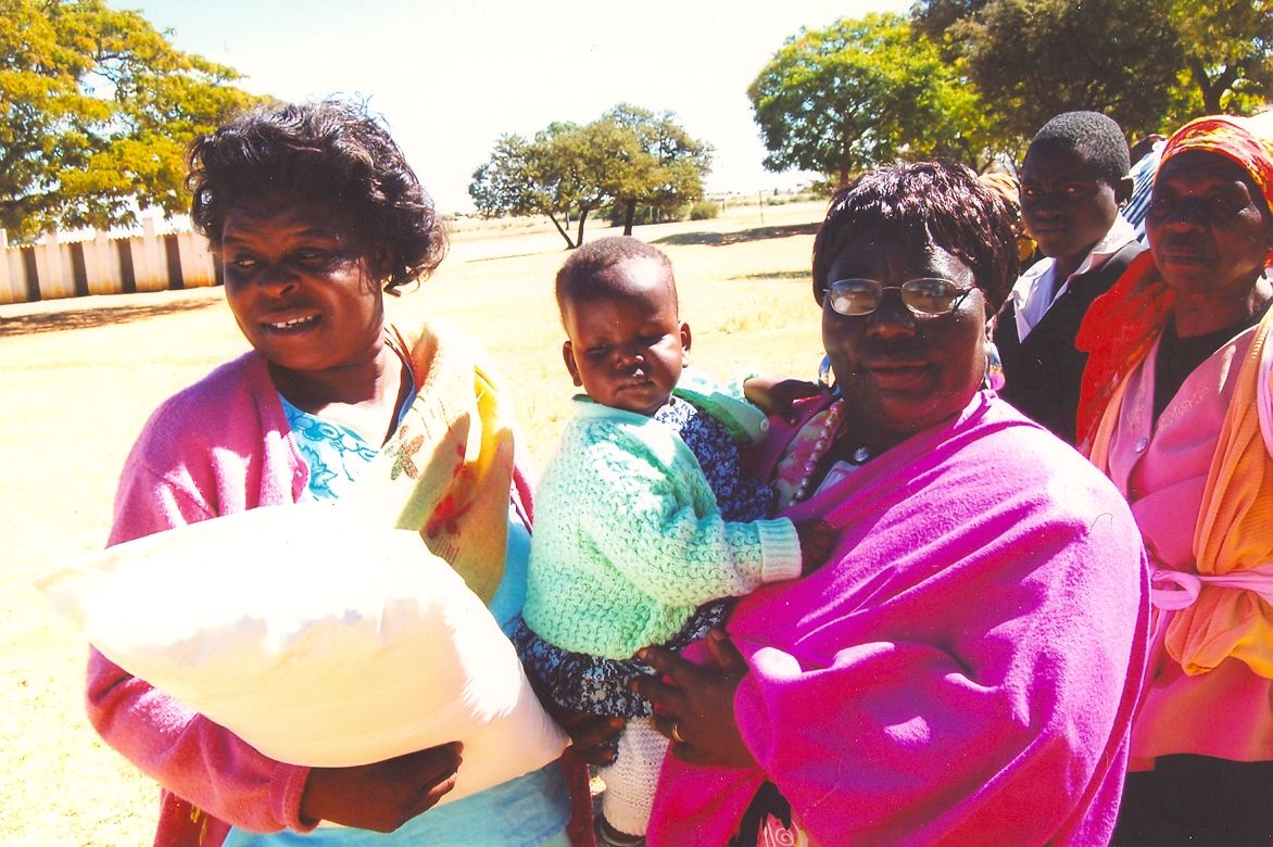 AWC giving food aid to orphans 2007