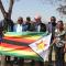 Gift of Zimbabwe flag at Western Suburbs Housing Union